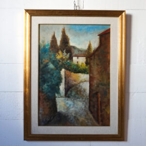 Dipinto a olio raffigurante un paesaggio collinare emiliano con cipressi, case rurali e sentiero, firmato G. Gagliardi, con cornice dorata e passepartout.